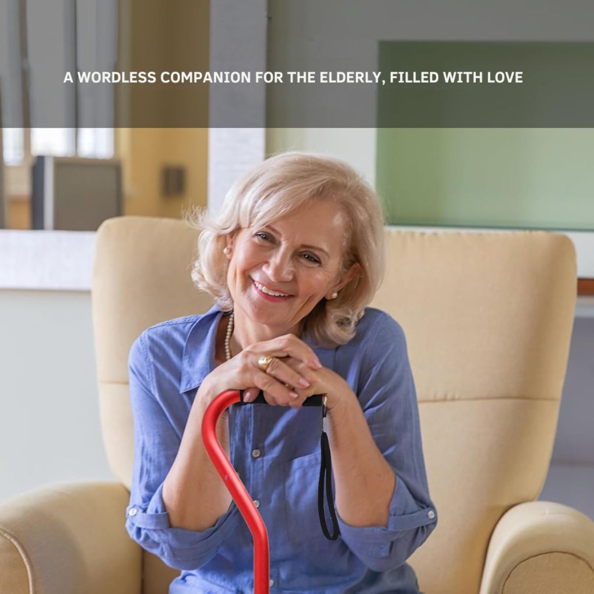 Smiling senior woman sitting comfortably and holding a red JC Health Aluminum Quad Cane, conveying independence and confidence.