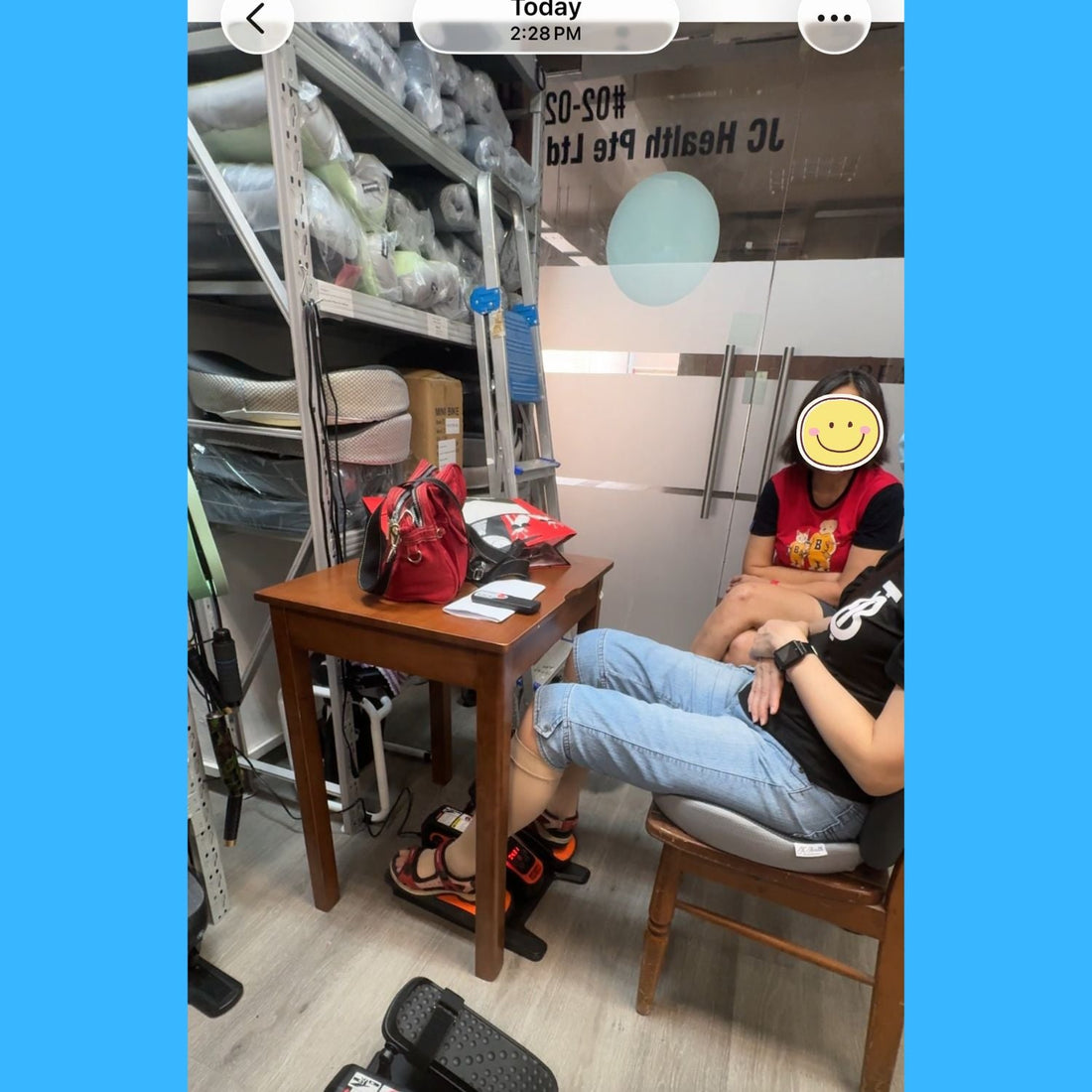 Two sisters testing the JCHealth Electric Mini Elliptical at our Singapore showroom for their 83-year-old mother's rehab