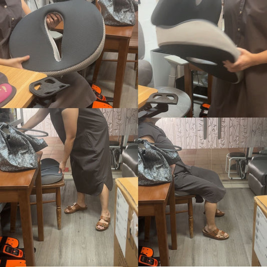 A mother testing the 2-in-1 lumbar and donut seat cushion set on a wooden chair at the JC Health showroom before her daughter's hemorrhoid surgery