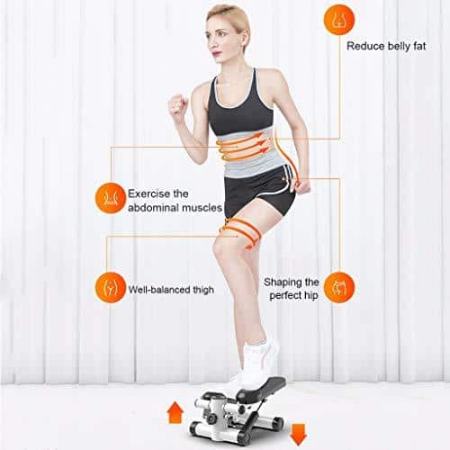 Senior woman using mini stepper at home for balance improvement and low-impact exercise