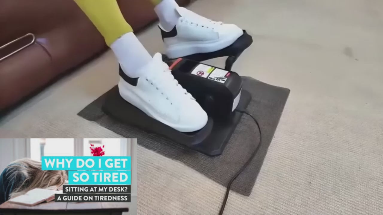 A woman uses the quiet and compact JC Health elliptical trainer with a remote control, demonstrating how to exercise while reading on a sofa. The trainer is easy to grab for storage.