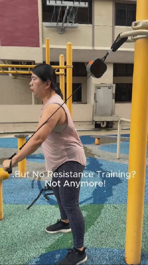 a lady showing how she can just bring a fitness pump and exercise at HDB fitness corner, hook it and start training, with adjustable resistant, no crowded gym and monthly gym fee. fitness anywhere anytime