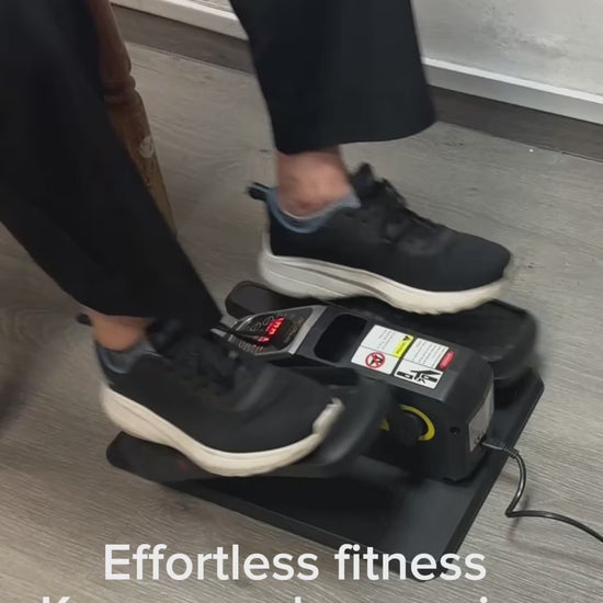 In-store customer demonstration of JC Health elliptical trainer showing quiet motor operation, compact design, and ease of use for leg exercise