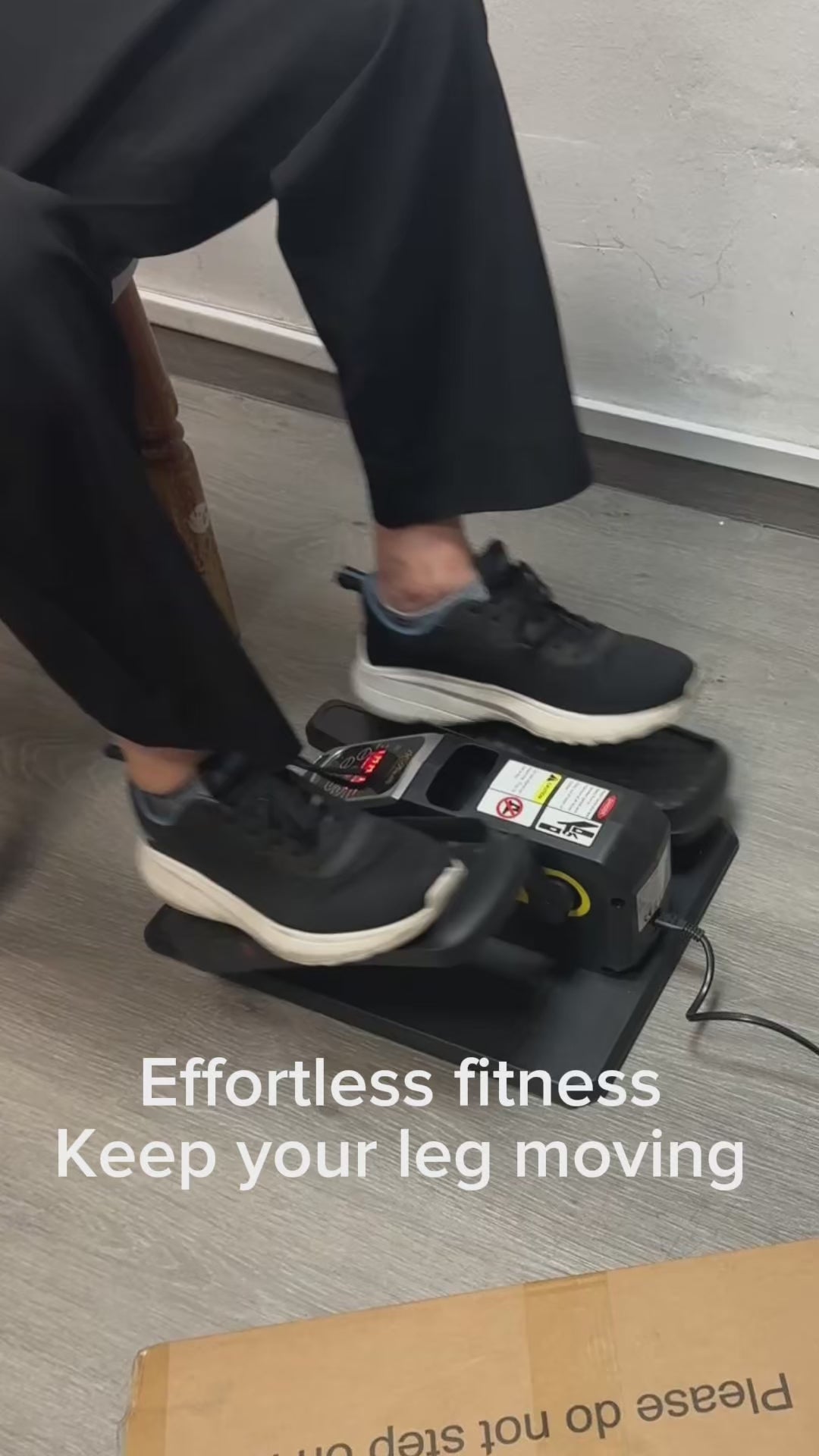 In-store customer demonstration of JC Health elliptical trainer showing quiet motor operation, compact design, and ease of use for leg exercise